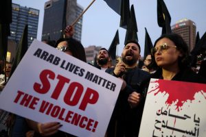 Members of Israel's Arab minority protest, in Tel Aviv